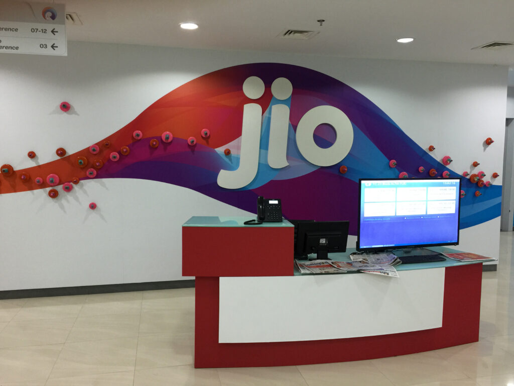 Office wall graphics for corporate branding at Jio reception area