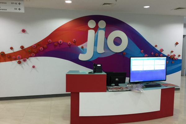 Office wall graphics for corporate branding at Jio reception area