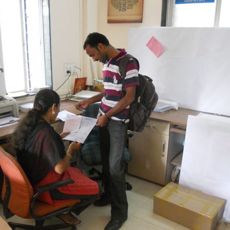 Printing team operating a high-capacity printing press